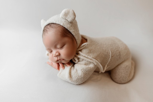 Baby practicing pushing up on hands during tummy time (when do babies start crawling)