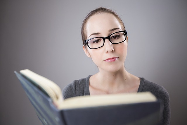 College student looking stressed at books and bills