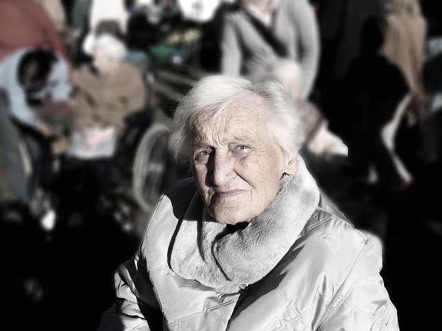 A grandmother hugging her young granddaughter, with a warm, loving expression.