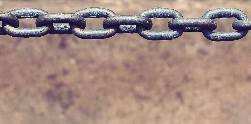 person breaking chains