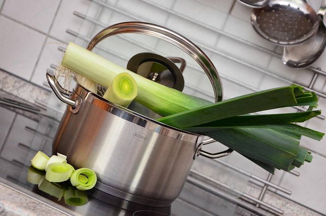 Person cooking a healthy meal from scratch in a home kitchen
