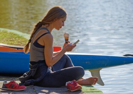 person looking at phone thoughtfully