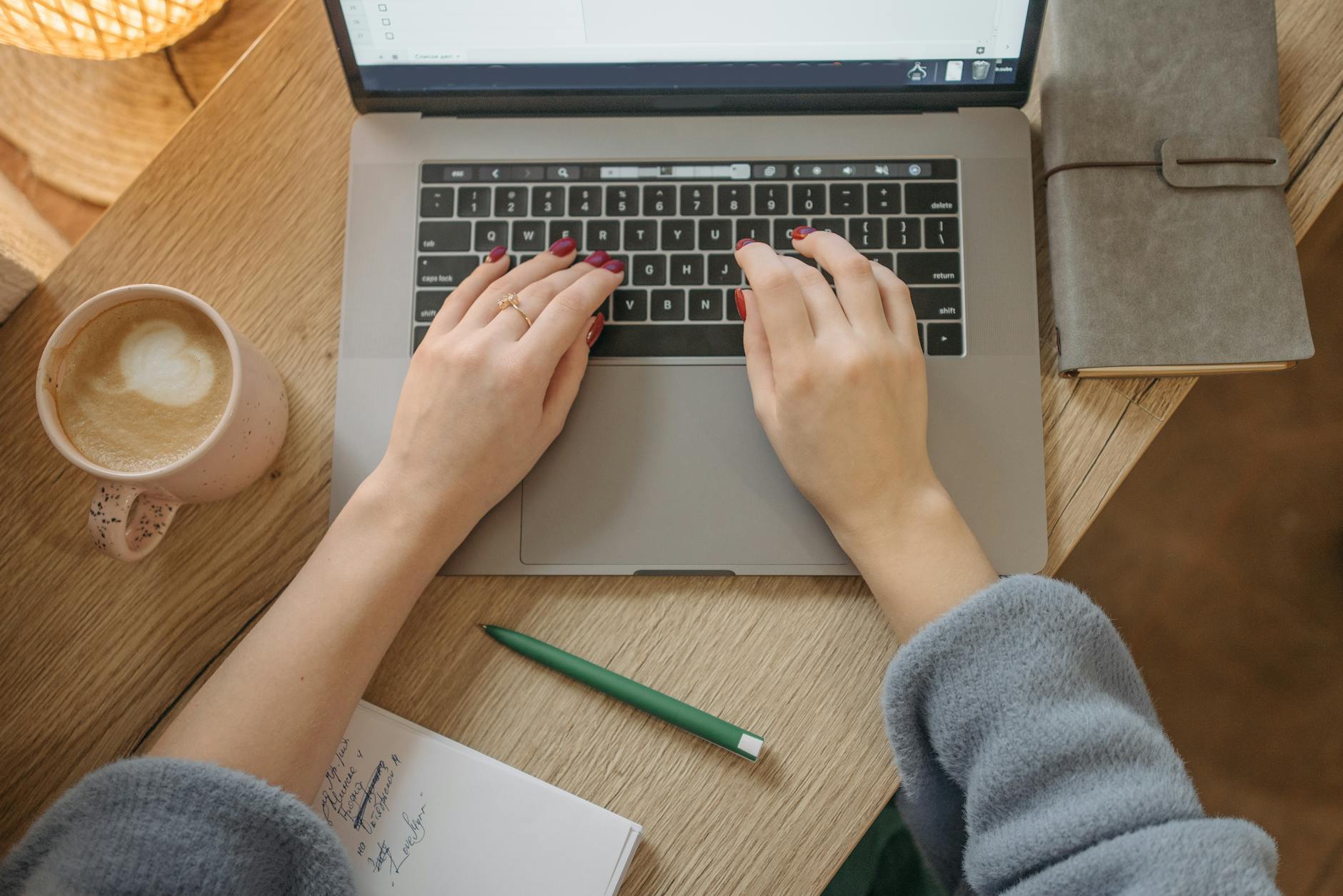 person writing on laptop blog