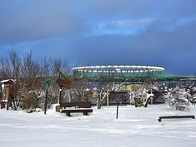 Air traffic control tower with planes on tarmac (fli)