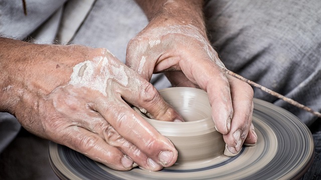 Artist working in a well-lit studio space provided by a residency program