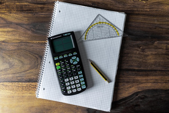 A calculator and a notepad with handwritten cleaning service quotes