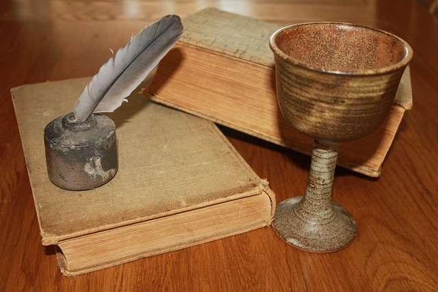 Close-up of a quill pen writing on parchment, symbolizing Shakespeare's poetry