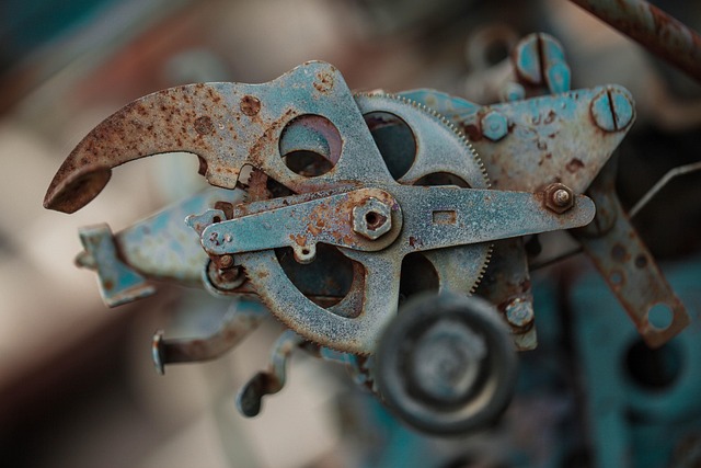 Close-up of a rusted steel pipe clamp indicating potential failure