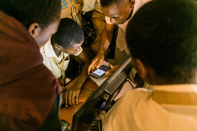 Diverse group of adults learning basic computer skills at a community center