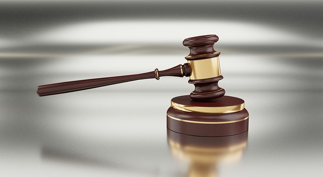A gavel and legal documents on a desk, symbolizing legal disputes and court proceedings.