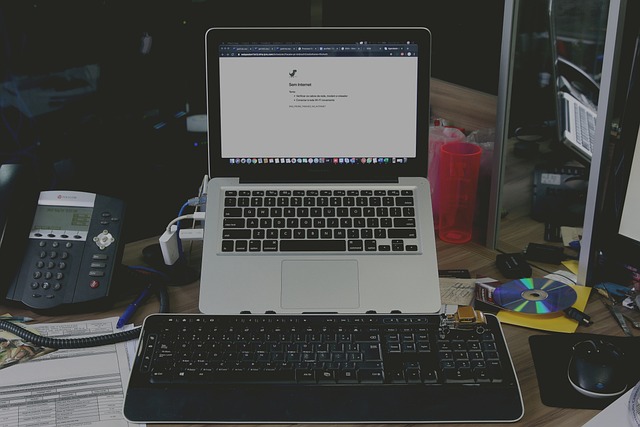 MacBook Pro screen displaying a small orange spot near the edge