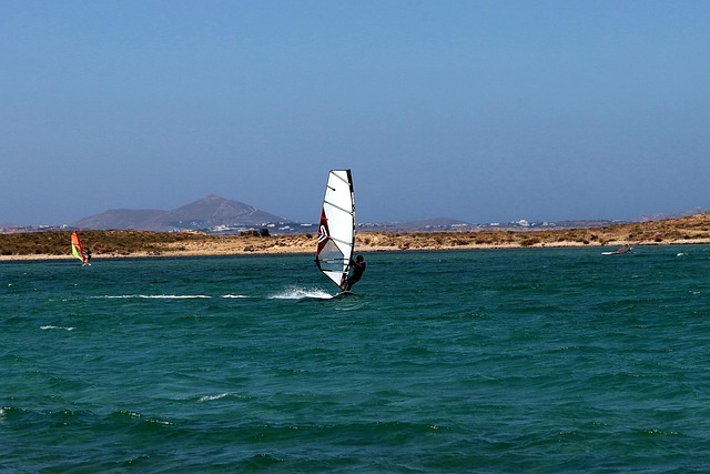 Modern windsurfing gear including carbon fiber board and sail