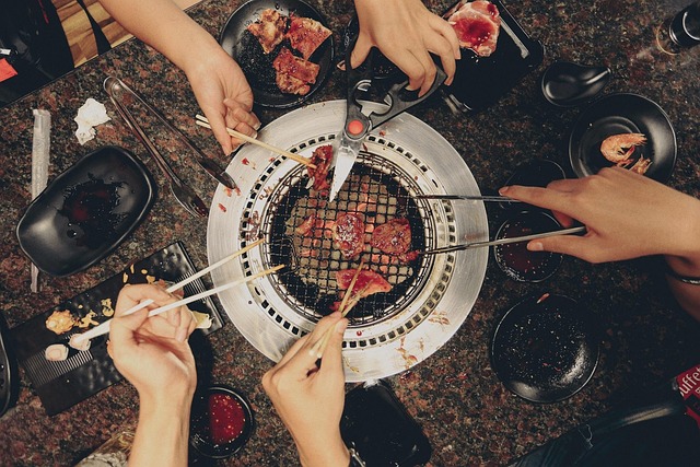 People sharing food and talking in a communal setting during difficult times