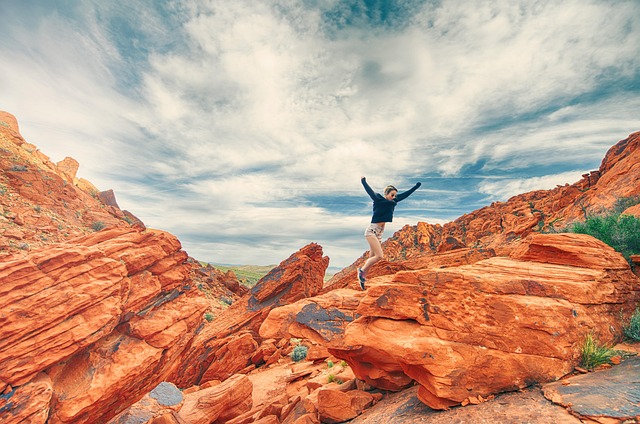 A person jumping for joy, face lit up with excitement