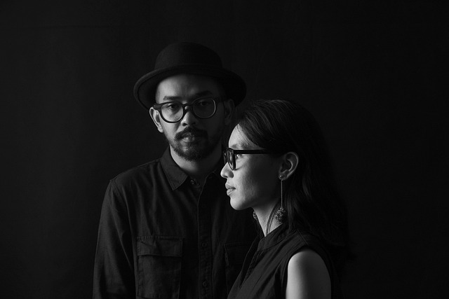 Two people in a studio setting recording a podcast interview