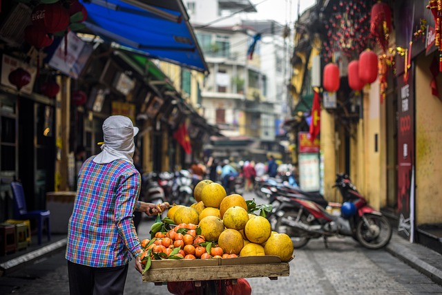 A vibrant street scene in a major Southwest Asian city, showcasing diverse people and architectural styles.