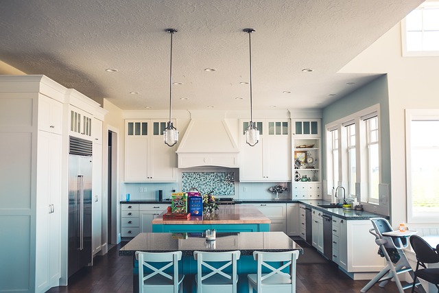 modern kitchen island with granite countertops and pendant lighting